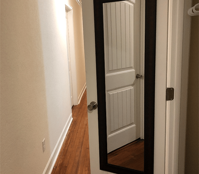 Hall closet with full length mirror