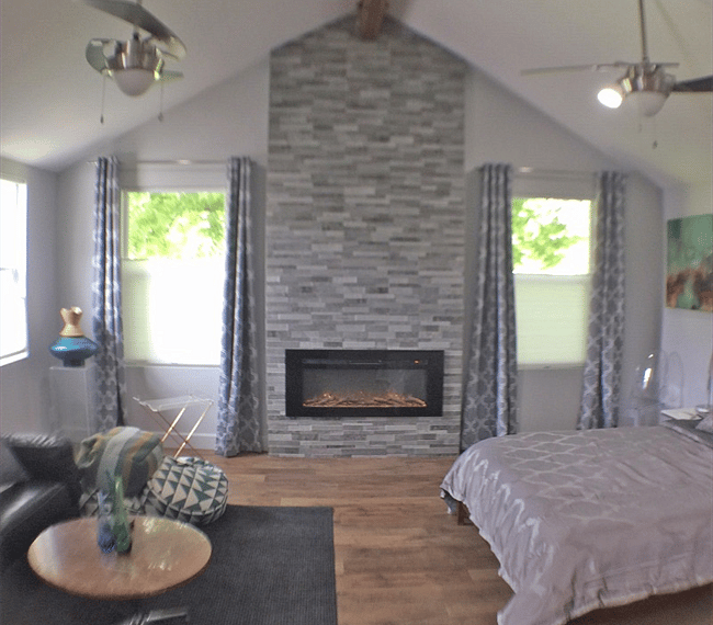 Cozy up with a blanket of the leather sofa and enjoy the electric fireplace.