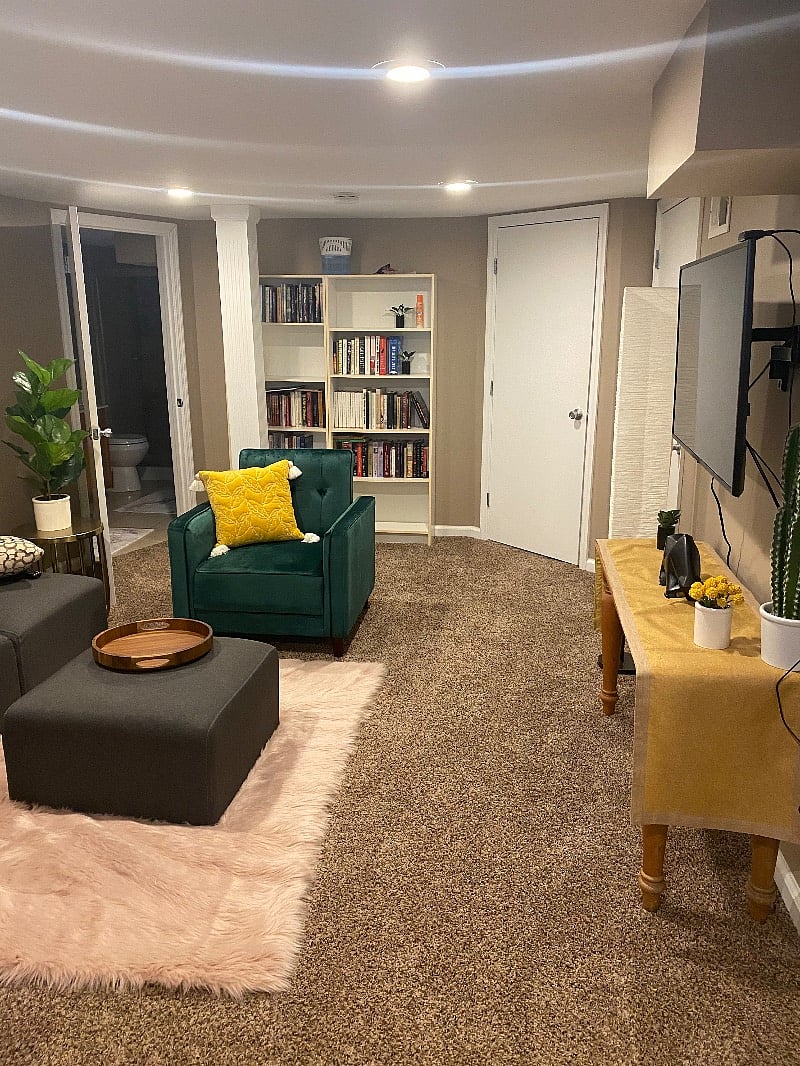 Basement den, bathroom on left and bedroom door on right