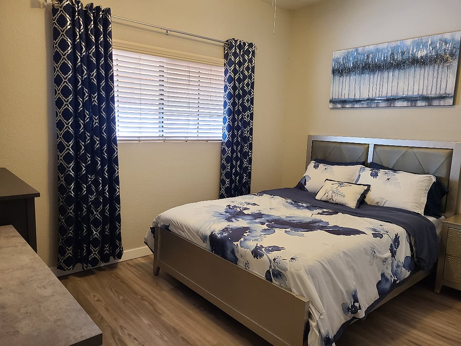 4" Tempur-Pedic mattress topper on mattress.
