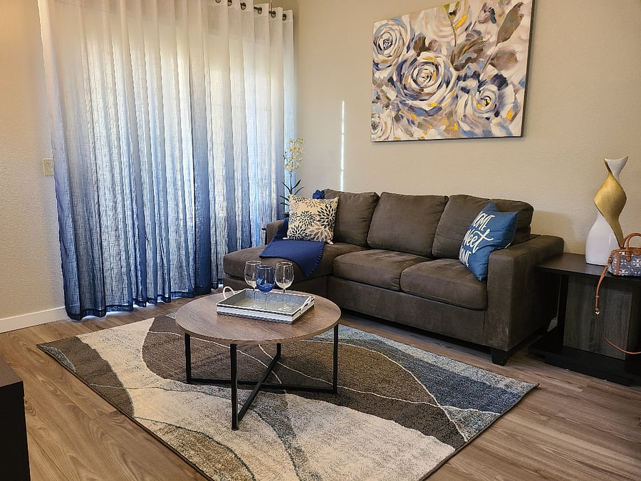 Sofa in living room has a reversible chaise.