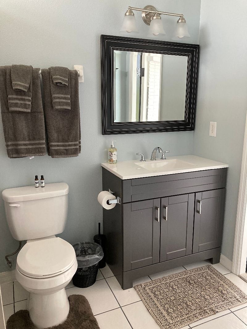 This Bathroom has a door to the back patio.