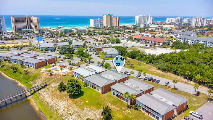 Aerial view of beach front with your condo building in the foreground