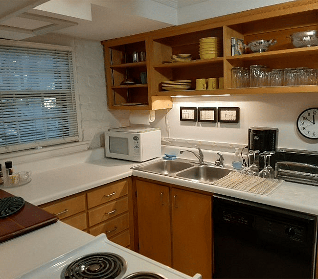 Ample cabinets, shelves and countertops