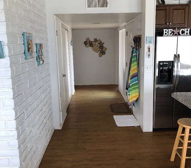 Hallway leading to bedrooms and bathroom
