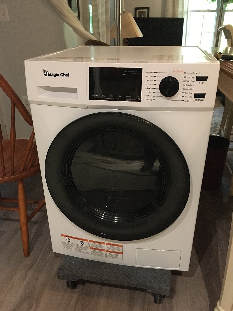 This is an all-in-one washer/dryer with a steam setting to sanitize your scrubs.
It is located to the left of the bar in the closet. The controls allow you to do your laundry while you work.