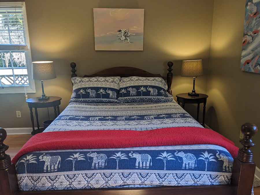 Primary Bedroom queen bed with ensuite half-bath.