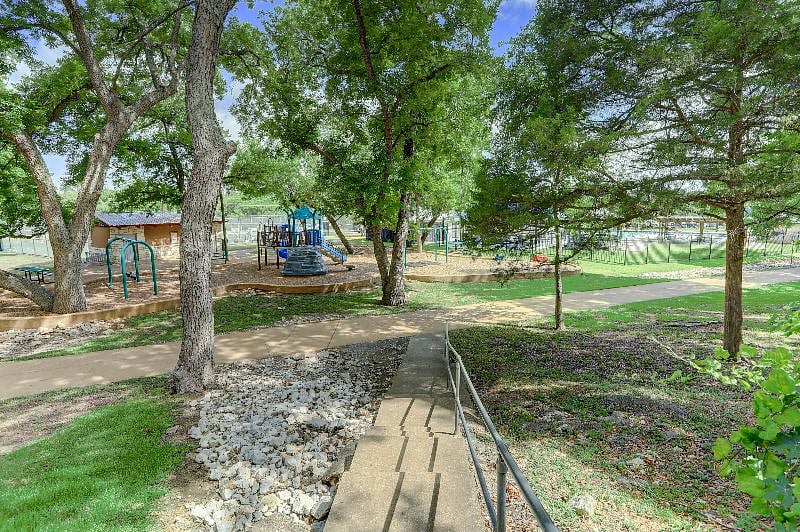 The stairs only 4 houses down leading to your endless adventure opportunities- the 10 mile Brushy Creek trail, park, tennis courts, pool (with membership), basketball court, duck pond with fishing and so much more!
