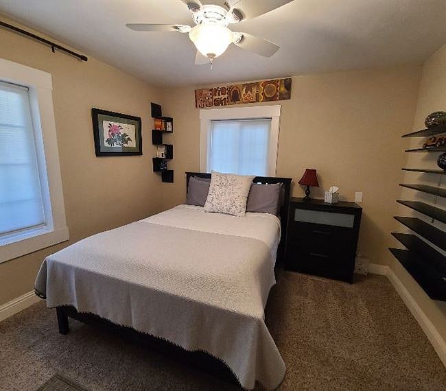 Bedroom 1 - Queen size bed, dresser, and closet.