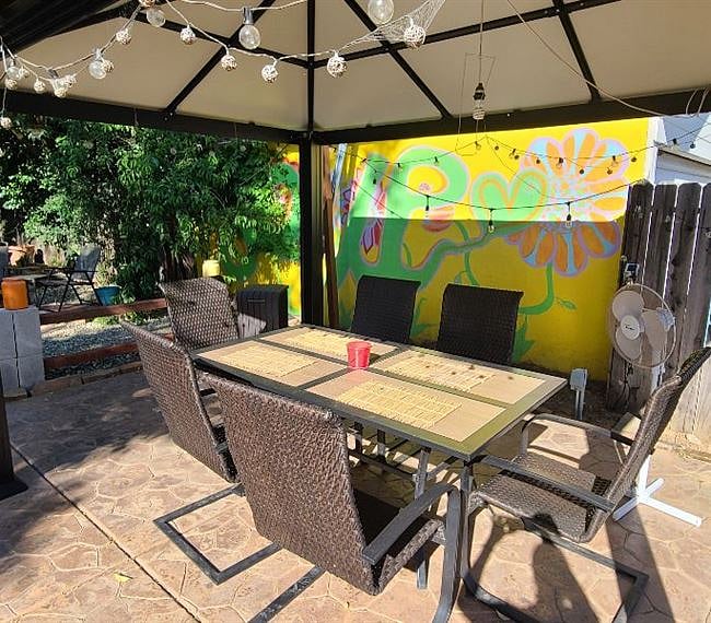 Outdoor covered seating area. Grill for use
