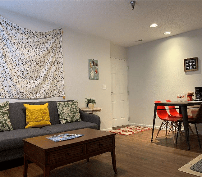 Living area with a comfortable couch and pillows