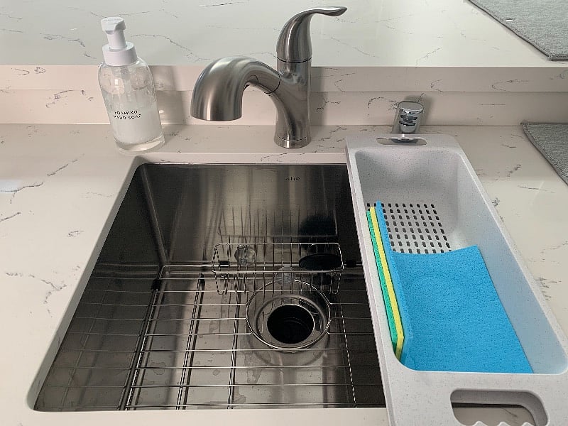 sink with garbage disposal, basic cleaning products provided