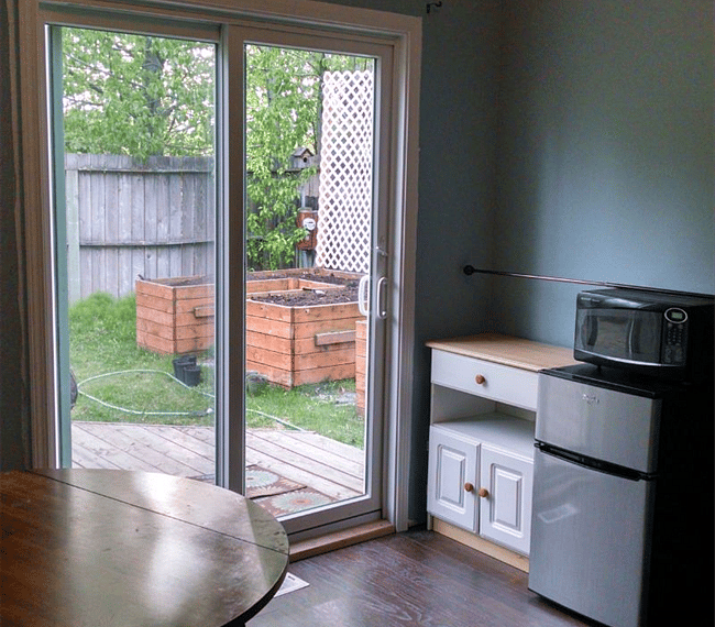 View from the door to the bonus room. There are now shelves above the cabinet as well.