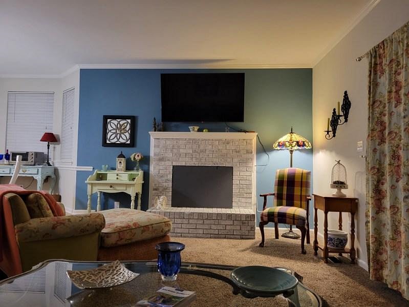 The living room has a 55 inch Roku smart TV.