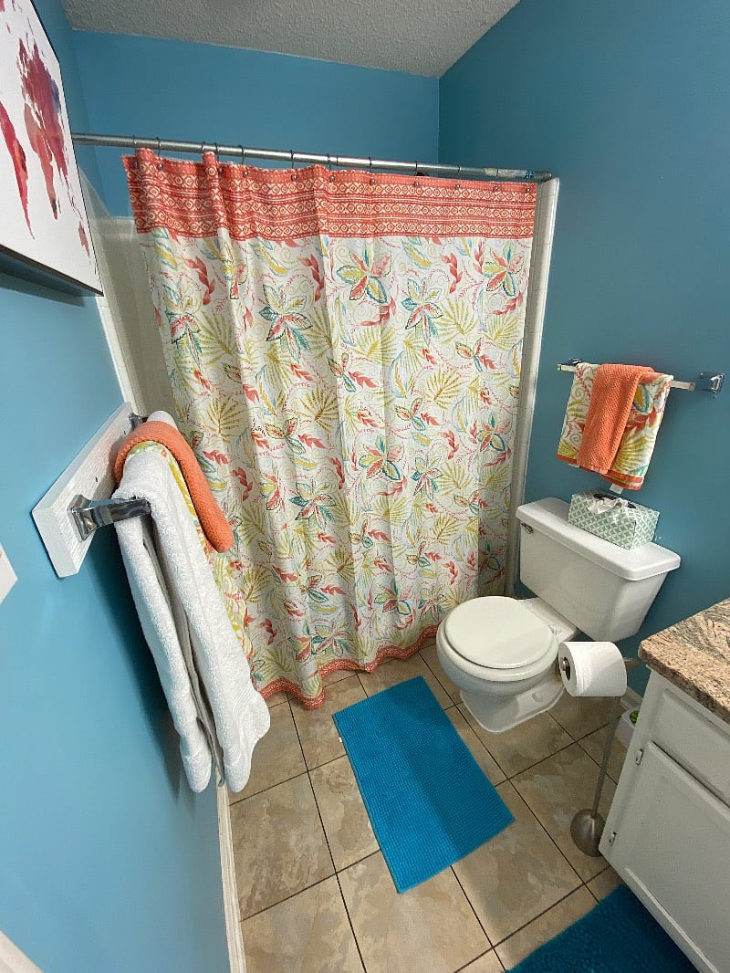 Full bath with granite counter tops.