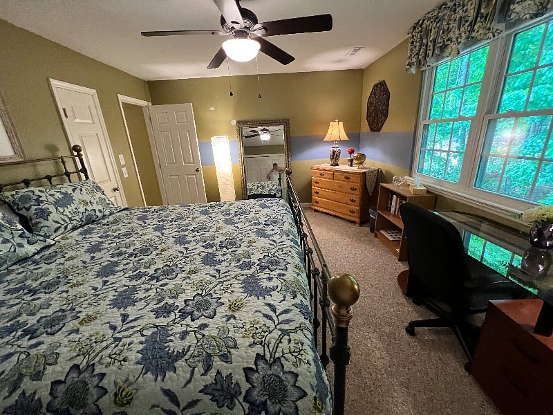 Master bedroom with king size bed and plenty of closet space.