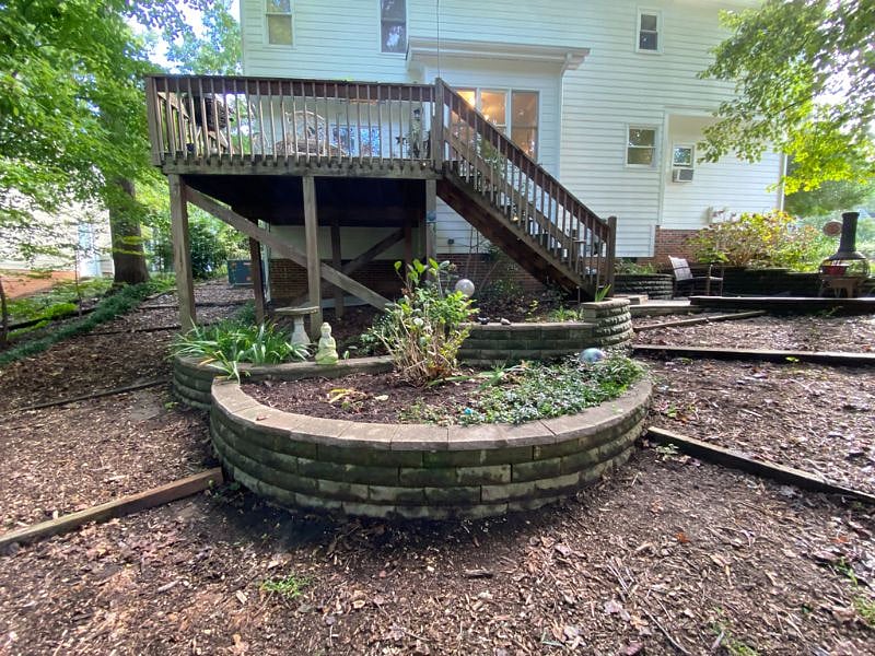 The home is surrounded by gardens.