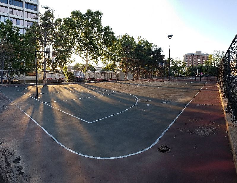 Basketball court.  Shoot some hoops or join others in a quick game.