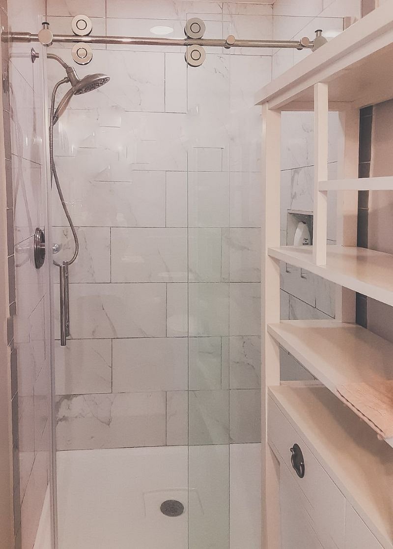 A spacious shower features in the bathroom