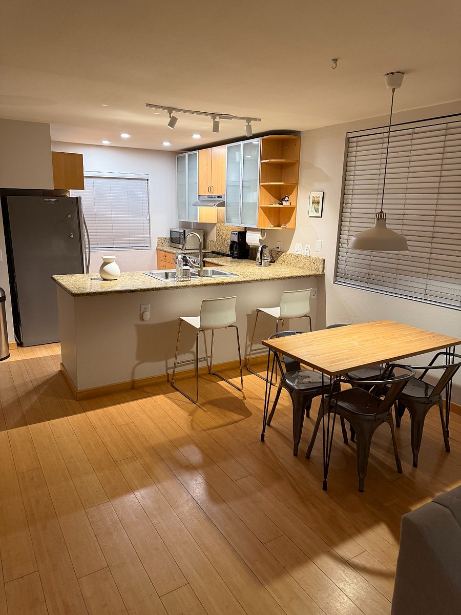 Dining area with room for four and two bar stools
