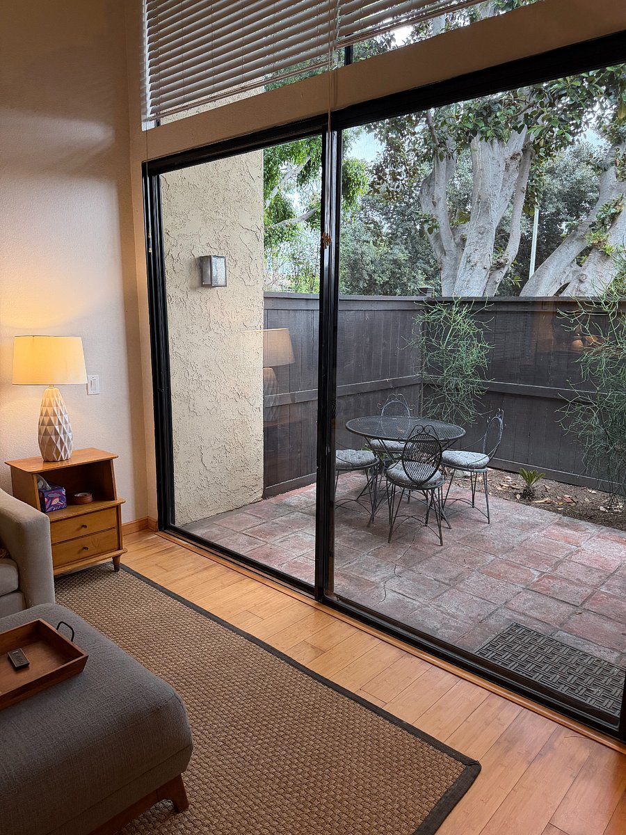 Enclosed patio with table and chairs