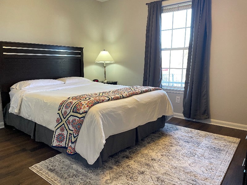 Second bedroom with queen sized bed and full dresser with a mirror (not seen in photo)