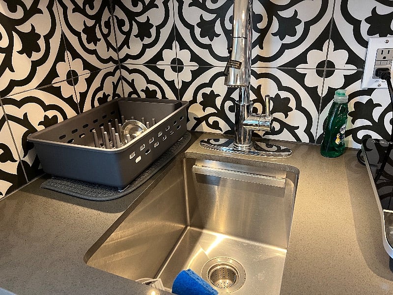 Deep stainless steel basin.