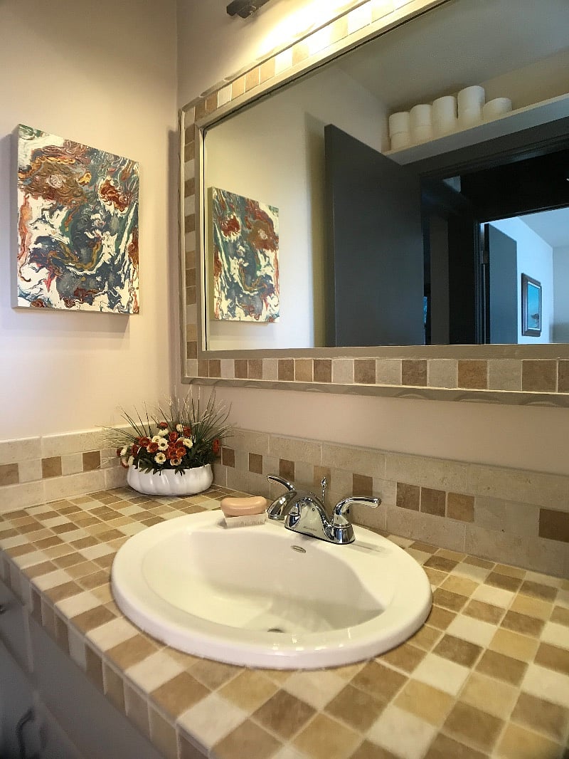 Bathroom has dedicated TP storage for Costco-size pack. Vanity cabinet has more storage. Good natural light.