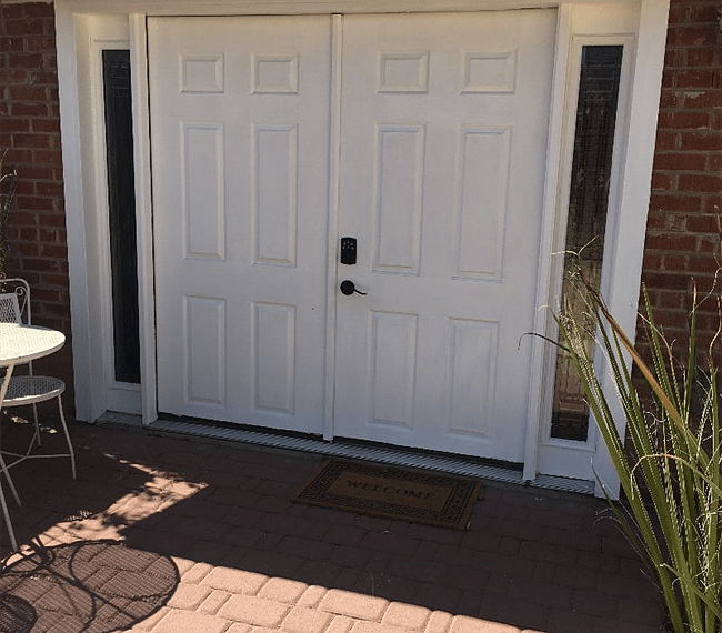 Front door entrance with keypad lock.