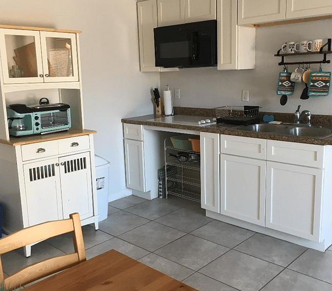 Full Kitchen with a cooktop and a 3-in-1 toaster oven, coffee maker, and griddle.