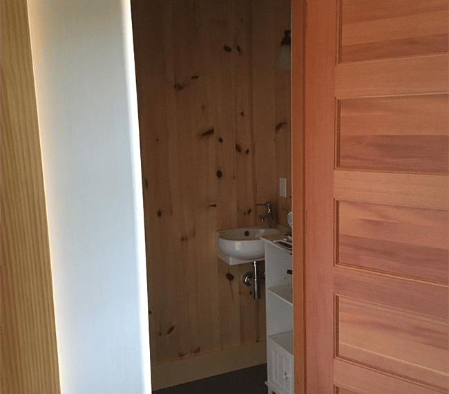 Half bath in the common living area., off of the kitchen area
