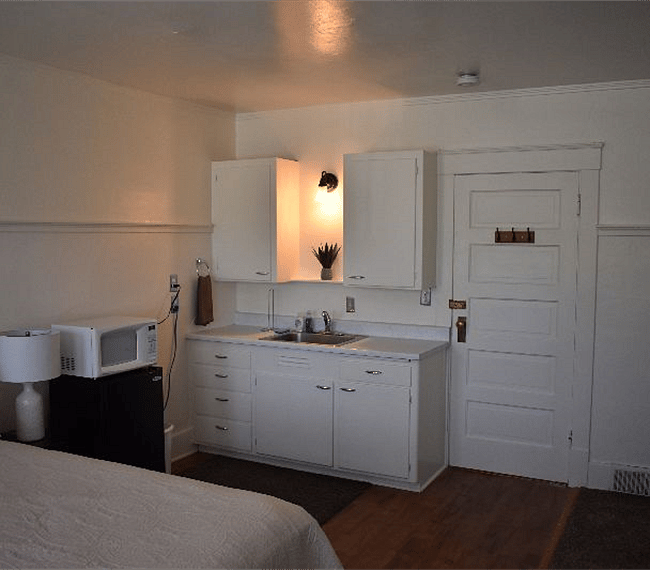 North Room - Microwave, mini fridge, a sink and cabinets supplied with dishes