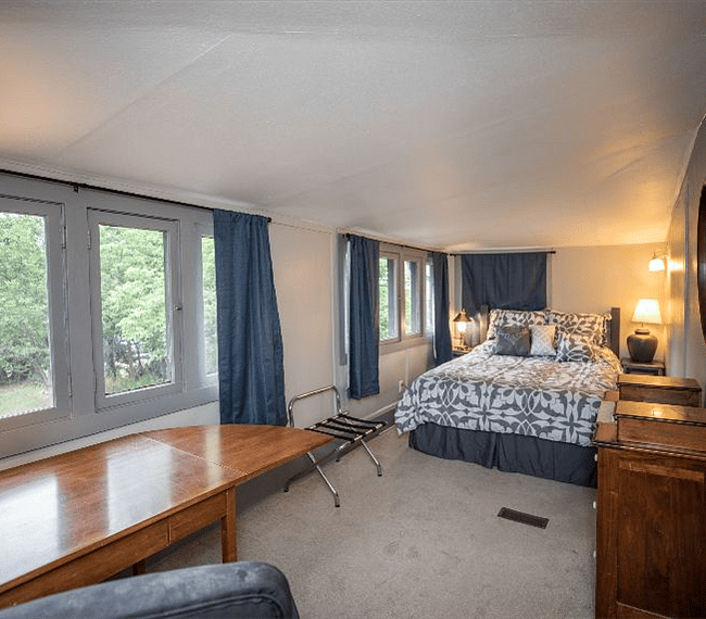 Main level bedroom with queen bed.