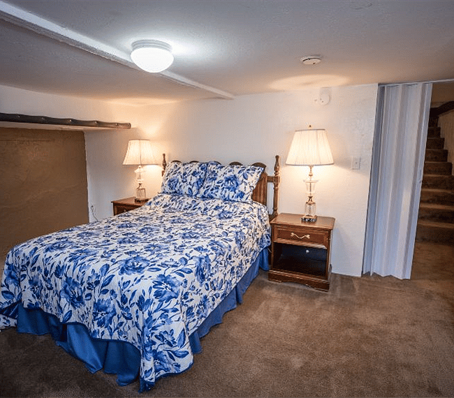 Lower level bedroom queen bed, desk is in the room but not in the picture.