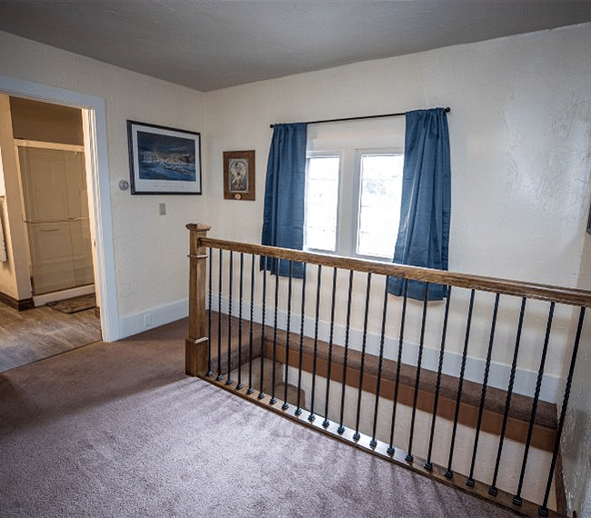 Bathroom and stairs leading to the lower level.