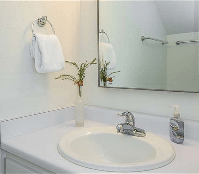 This powder room is located on the first floor, off the family room.