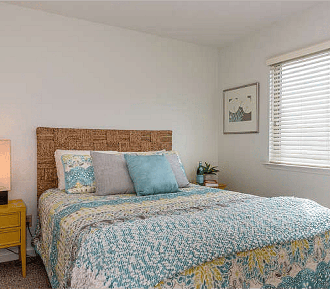 Upstairs - Bedroom Two - Queen Bed, Reading Lamps, and Dresser located within the closet.