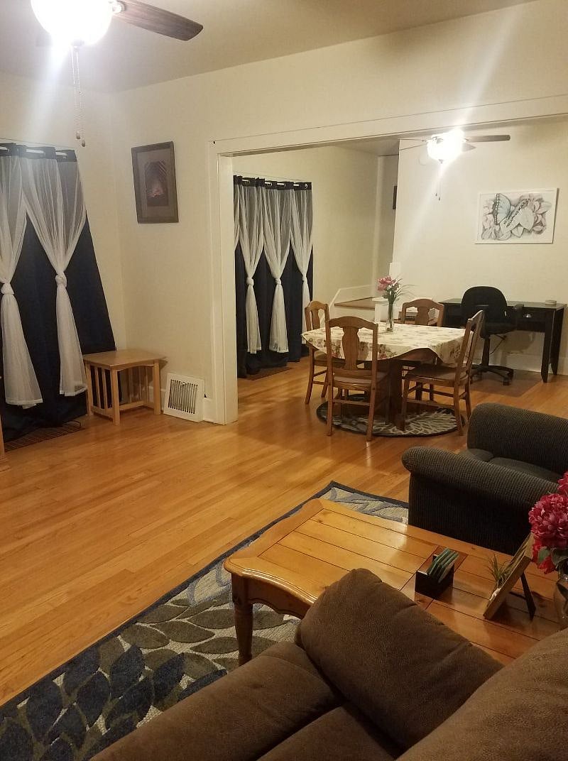 Dining room with desk and printer in background.