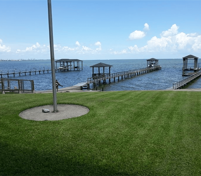 Backyard *Pier in background was destroyed in recent hurricane and is currently unusable. 