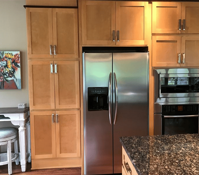 The kitchen offers an LG French door refrigerator/freezer with ice maker and water dispenser in the door, electric oven and microwave.