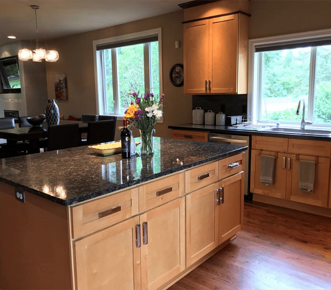 The beautiful granite island offers lots of space to create meals on the go or gourmet family get-togethers.