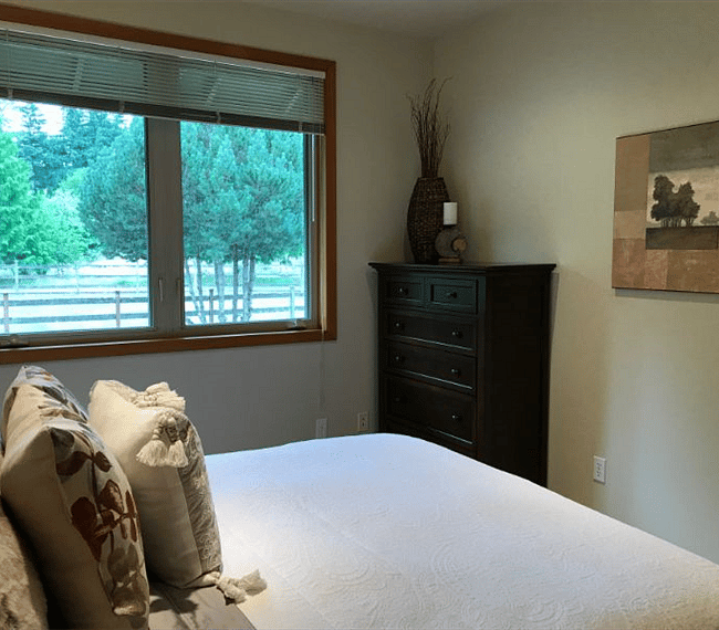The window in Bedroom 1 has a lovely view of the front gardens. The window also has blinds for privacy and room darkening.