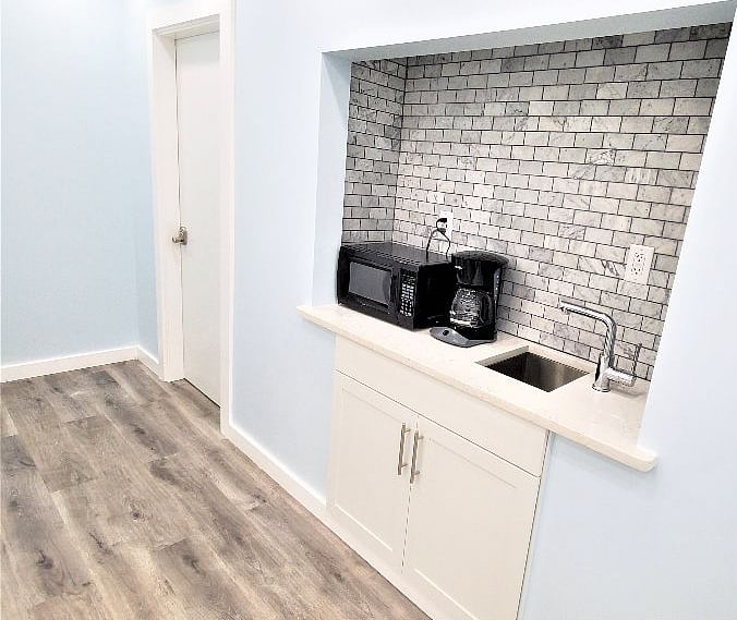 There is a Wet Bar outside the bedroom. Come get a quick cup of purified water, make some coffee or use the microwave.