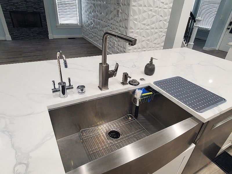 To the left is a second faucet that provides double filtered water. The right lever provides InstaHot water at 190 degrees. Brew your tea with pre heated water or use on instant oatmeal or other meal option for a quick-cooked meal.