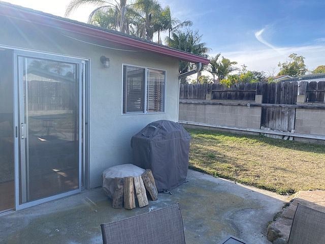 Backyard area w/ small firepit & Grill