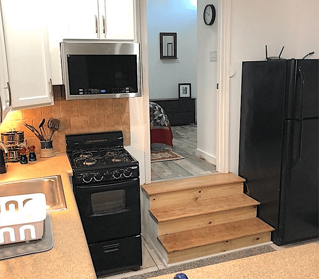 Microwave, gas stove, and oven.