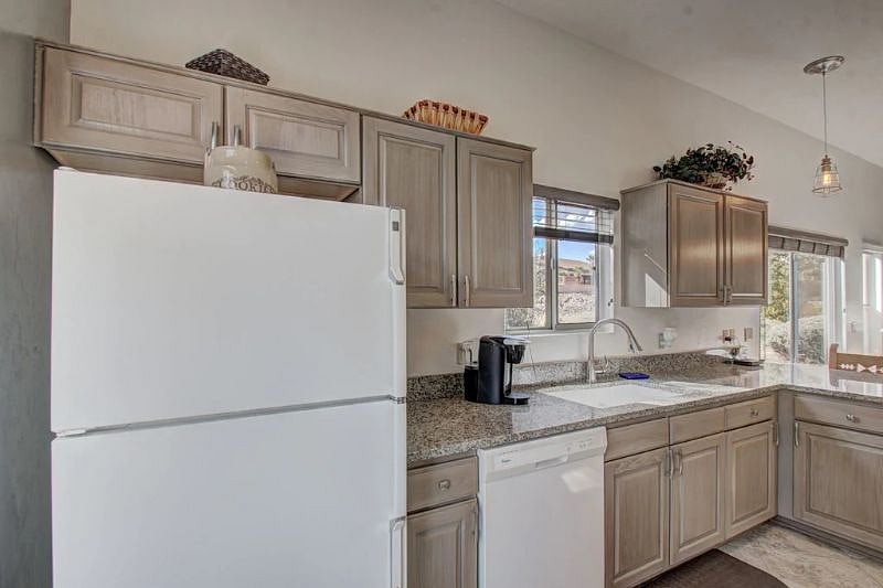 Unit A, Large ice maker fridge, dishwasher, Coffee Maker-Keurig style, viewing window over sink.