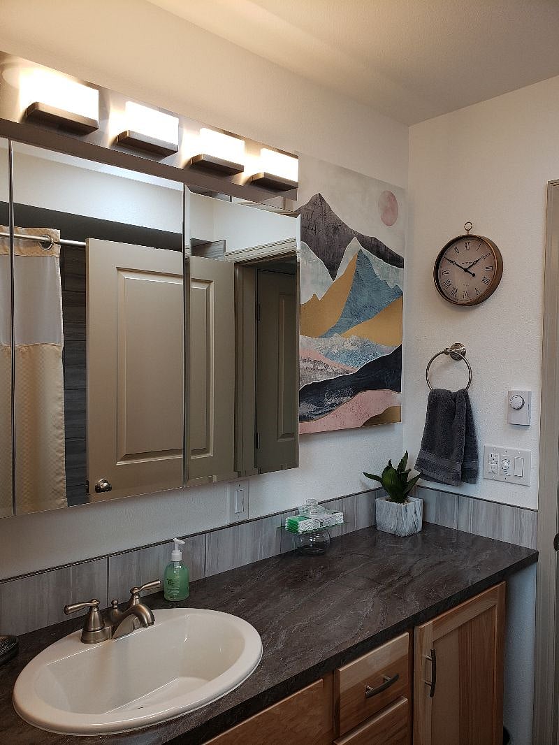 I have a hunch that you will LOVE the roomy bathroom...Warm, cozy...Full size and you'll love the tile bath area and all the convenient caddies and brushed nickel fixtures. Cell charging USB's in here as well.