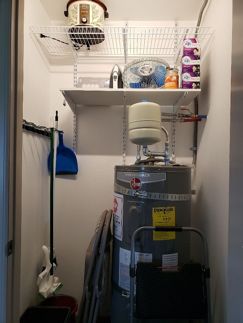 This is the water heater room, broom, mop, buckets, step ladder, extra fan, candles, matches, crock pot, Iron and Ironing board of course, and some other goodies and some additional shelves too...