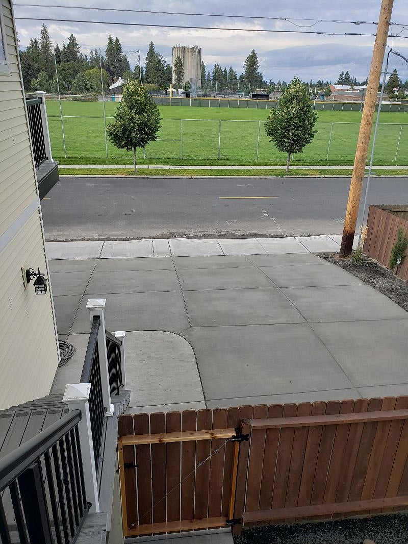 A view looking from the top landing area, (there's also a nice sitting area up here) Looking North towards 37th street and your Guest parking and part of your parking too...Shrubs on the right auto-watered!